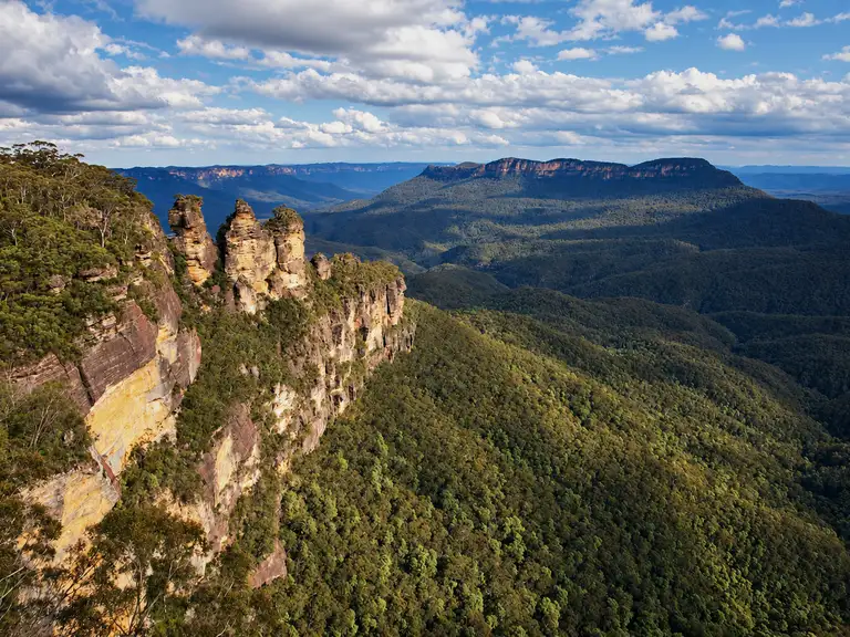 Rock spires above a forested valley near the Three Sisters walk, Katoomba, NSW.