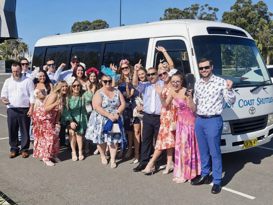Customers beside a minibus.