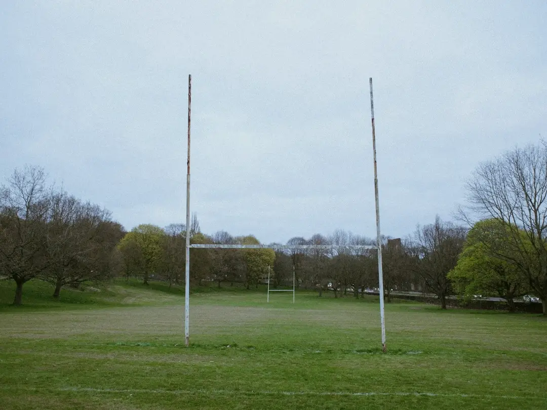 Rugby goal posts on a grass field.