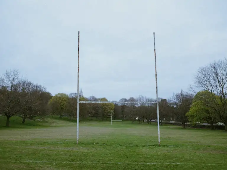 Rugby goal posts on a grass field.